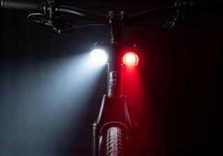 Close up of bright cycling lights mounted on a bike